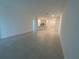 Open concept living room featuring tiled flooring and access to the kitchen at 4053 Redbridge Loop, Davenport, FL 33837