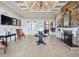 Lobby with stone fireplace, tile flooring, and elegant decor at 4053 Redbridge Loop, Davenport, FL 33837