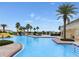 Resort-style pool with a slide and lush landscaping at 4053 Redbridge Loop, Davenport, FL 33837