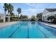 Large pool with lap lanes and lush landscaping at 4053 Redbridge Loop, Davenport, FL 33837