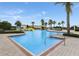 Community pool area with waterslide and palm trees at 4053 Redbridge Loop, Davenport, FL 33837