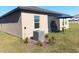 Well maintained backyard is perfect for entertaining with a patio, table, chairs, and umbrella at 409 Conway Ave, St Cloud, FL 34771