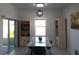 Bright dining area featuring a modern table, stylish chairs, and sliding glass doors leading to the outdoor space at 409 Conway Ave, St Cloud, FL 34771