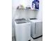 Convenient laundry room includes newer Samsung washer and dryer along with plenty of storage space at 409 Conway Ave, St Cloud, FL 34771