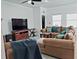 Inviting living room with comfortable seating, a large television, and ample space for relaxation and entertainment at 409 Conway Ave, St Cloud, FL 34771