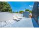 Lounge chairs in a screened pool area with a shed, creating a private and comfortable backyard oasis at 435 Pennsylvania Ave, St Cloud, FL 34769