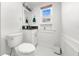 Clean bathroom featuring a toilet, a vanity, and a mirror at 435 Pennsylvania Ave, St Cloud, FL 34769