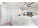 Bright bedroom featuring closet, ceiling fan, and television at 435 Pennsylvania Ave, St Cloud, FL 34769