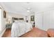 Cozy bedroom featuring a ceiling fan, closet, and an exterior view at 435 Pennsylvania Ave, St Cloud, FL 34769