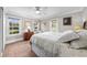 Bright bedroom features tile floors, lots of natural light, and neutral decor at 435 Pennsylvania Ave, St Cloud, FL 34769