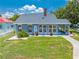 Charming house with a well-kept lawn, showcasing its neat landscaping and appealing architectural design at 435 Pennsylvania Ave, St Cloud, FL 34769