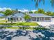 Charming home featuring a unique facade, complemented by a well-manicured lawn and an inviting driveway at 435 Pennsylvania Ave, St Cloud, FL 34769