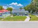 Inviting single-story home with a pathway, manicured lawn, and welcoming front porch at 435 Pennsylvania Ave, St Cloud, FL 34769