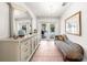 Hallway leading to a pool featuring a decorative dresser and chaise at 435 Pennsylvania Ave, St Cloud, FL 34769