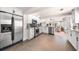 Open kitchen with stainless steel appliances, white cabinetry, and seamless flow to a bright, airy living space at 435 Pennsylvania Ave, St Cloud, FL 34769