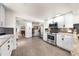 Bright, modern kitchen with white cabinets, stainless steel appliances, and stylish backsplash at 435 Pennsylvania Ave, St Cloud, FL 34769