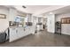 Bright kitchen featuring white cabinetry, tiled backsplash, and modern fixtures in a clean, open space at 435 Pennsylvania Ave, St Cloud, FL 34769