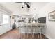 Open kitchen with bar stool seating at the granite countertop at 435 Pennsylvania Ave, St Cloud, FL 34769