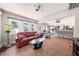 Open living room connecting to the kitchen and outdoor pool area at 435 Pennsylvania Ave, St Cloud, FL 34769