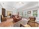 Spacious living room with vaulted ceilings, ample natural light, and tile flooring at 435 Pennsylvania Ave, St Cloud, FL 34769