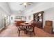 Open living room featuring tile floors, comfortable seating, and a dining area at 435 Pennsylvania Ave, St Cloud, FL 34769