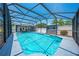 Stunning pool area with an enclosing screen, showcasing a shed and relaxing outdoor space at 435 Pennsylvania Ave, St Cloud, FL 34769