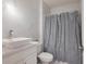 Modern bathroom featuring a marble-tiled shower, vessel sink, and sleek fixtures at 454 Hamlet Loop, Davenport, FL 33837