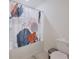 Bathtub in bathroom with shower curtain, toilet, and trash can at 454 Hamlet Loop, Davenport, FL 33837