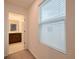 Bright bathroom with a window and a view to the water closet, enhancing its appeal at 454 Hamlet Loop, Davenport, FL 33837