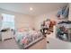 Bright bedroom with lots of stuffed animals and great natural light at 454 Hamlet Loop, Davenport, FL 33837