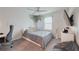 Cozy bedroom with a ceiling fan, TV, and decor at 454 Hamlet Loop, Davenport, FL 33837