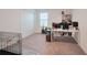 Spacious bedroom with neutral carpet, white walls, a desk, shelving, and a large closet at 454 Hamlet Loop, Davenport, FL 33837