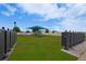 Community playground area featuring a shade structure, slide, and swings at 454 Hamlet Loop, Davenport, FL 33837
