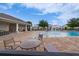 Community pool featuring a splash fountain, lounge chairs, and covered seating areas at 454 Hamlet Loop, Davenport, FL 33837