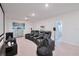 Home theater room with reclining chairs and a large projector screen for entertainment at 454 Hamlet Loop, Davenport, FL 33837