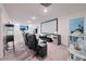 Home theater room with reclining chairs, projector screen, and entertainment equipment at 454 Hamlet Loop, Davenport, FL 33837