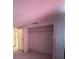 A well-lit empty closet with with a single bar for hanging clothes at 4905 Sanoma Vlg # Ge, Orlando, FL 32808
