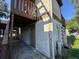 Exterior view of building with stucco and wood exterior and second story landing at 4905 Sanoma Vlg # Ge, Orlando, FL 32808