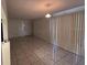 A spacious living room featuring tile flooring, natural light, and an open layout at 4905 Sanoma Vlg # Ge, Orlando, FL 32808