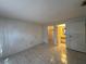 A well-lit main bedroom with tiled floor and access to en-suite bathroom and walk-in closet at 4905 Sanoma Vlg # Ge, Orlando, FL 32808
