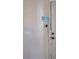 Wall with a door and a digital screen, and an electrical outlet at 4905 Sanoma Vlg # Ge, Orlando, FL 32808