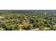 Expansive acreage with mature trees surrounds this charming home with large front porch and separate garage at 525 W Blue Springs Ave, Orange City, FL 32763
