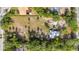 Aerial view of the expansive lot, highlighting the property's generous size, mature trees, and curb appeal at 525 W Blue Springs Ave, Orange City, FL 32763