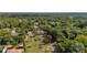 Expansive acreage with mature trees surrounds this charming home with large front porch and separate garage at 525 W Blue Springs Ave, Orange City, FL 32763