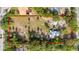 Aerial view of expansive lot showcasing the property's generous size, mature trees, and great curb appeal at 525 W Blue Springs Ave, Orange City, FL 32763