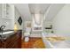 Bathroom featuring a vintage vanity, soaking tub, and natural light at 525 W Blue Springs Ave, Orange City, FL 32763