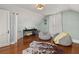 Cozy bedroom features hardwood floors, beanbag chairs, and vintage decor at 525 W Blue Springs Ave, Orange City, FL 32763