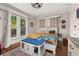 Bright bedroom with large windows, decorative rug, and rustic furniture at 525 W Blue Springs Ave, Orange City, FL 32763