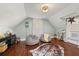 Attic converted into bonus room with hardwood floors and dormer windows at 525 W Blue Springs Ave, Orange City, FL 32763