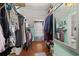 Walk-in closet featuring ample shelving and hanging space at 525 W Blue Springs Ave, Orange City, FL 32763